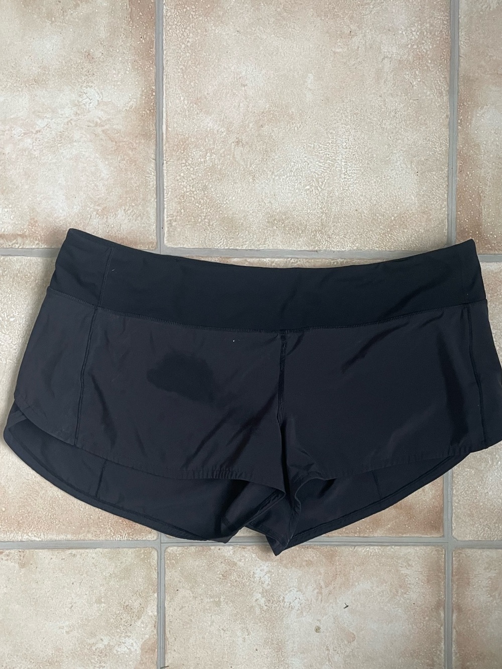 Lululemon black hotty hot athletic shorts, elastic waistband, hidden pocket; 12